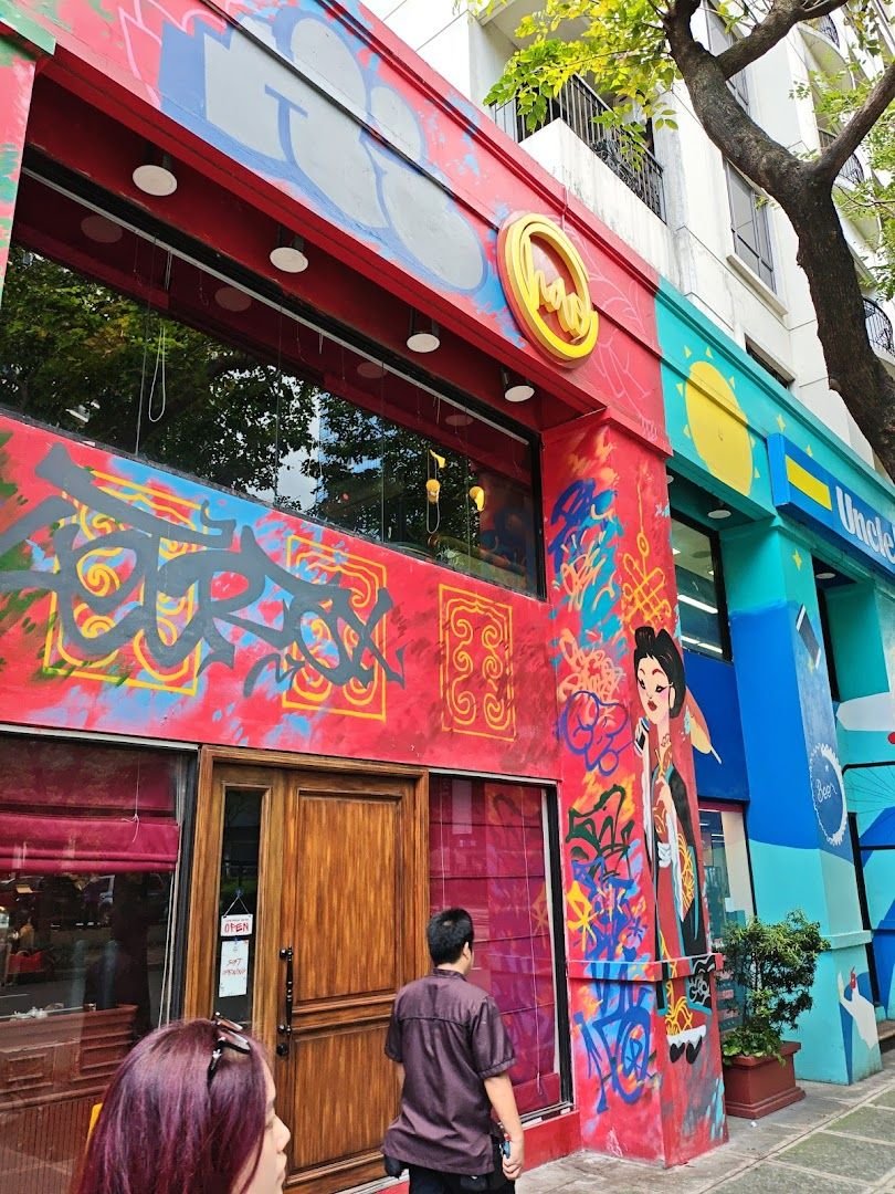 hăo vibrant graffiti exterior with colorful urban Chinese art on Rizal Drive
